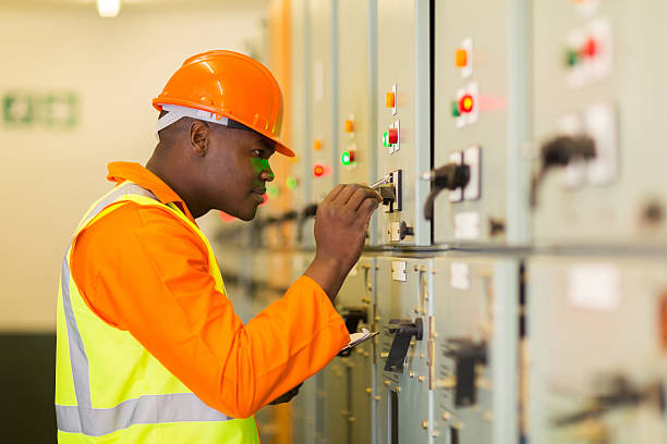professional african american technician writing down machine setting data